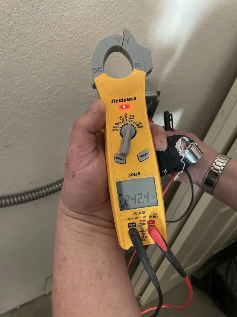 Voltage testing with clamp meter during Circuit Breaker Repair in Tiffin